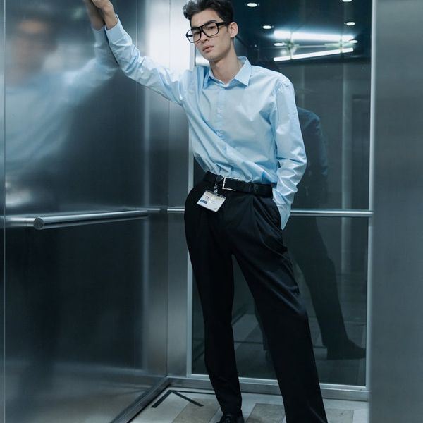 A man standing tall and confident looking at the horizon.