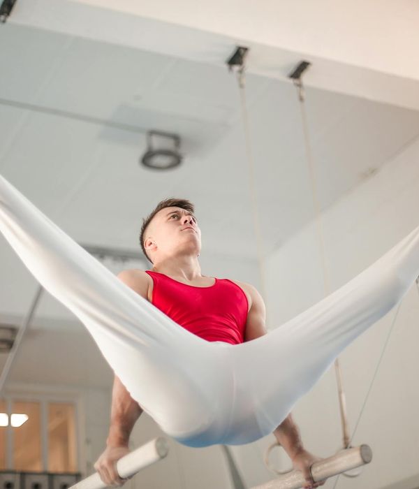 Man performing a strength exercise with focused expression.